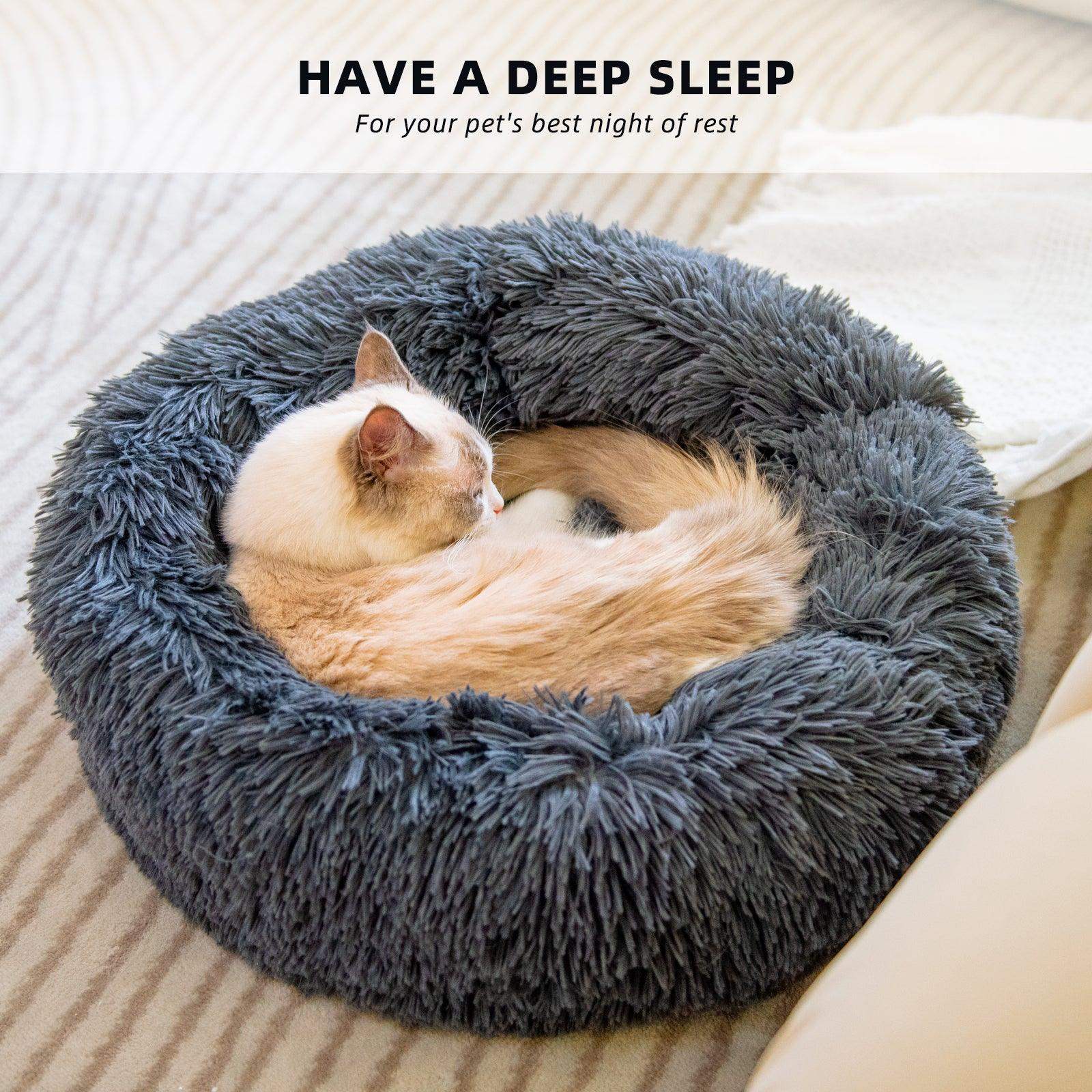 Plush faux-fur donut bed with soft raised sides for a small dog or cat to curl into