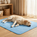 Yellow lab sleeping on blue cooling mat for dogs, cozy home setting with wooden floor and natural light
