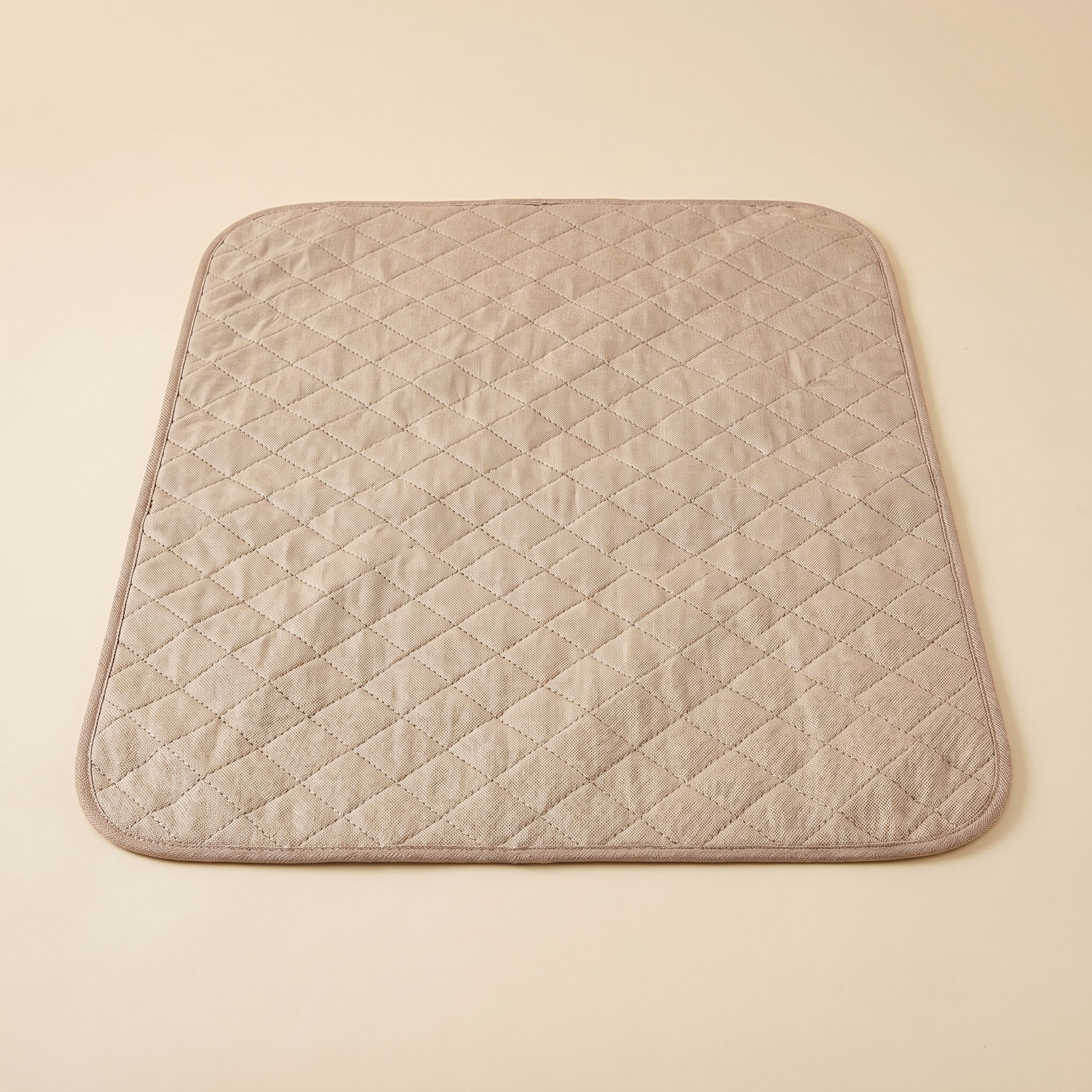 Beige quilted pet cooling mat for cats and dogs, cozy comfort for pets