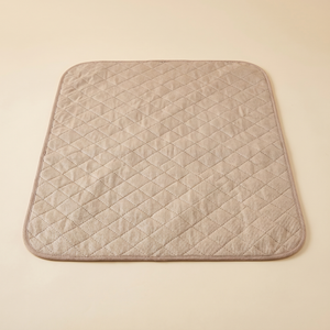 Beige quilted pet cooling mat for cats and dogs, cozy comfort for pets