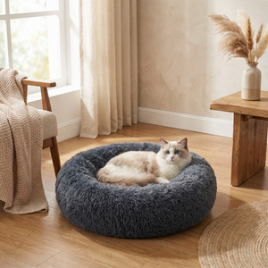 Fluffy gray cat bed with cozy Ragdoll cat resting, perfect for indoor pet comfort and relaxation.
