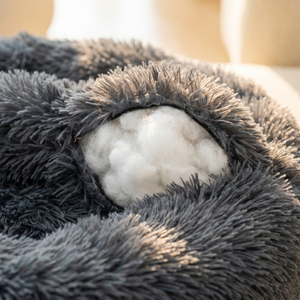 Ultra-soft gray pet bed with plush fur and cozy white filling for cats and dogs