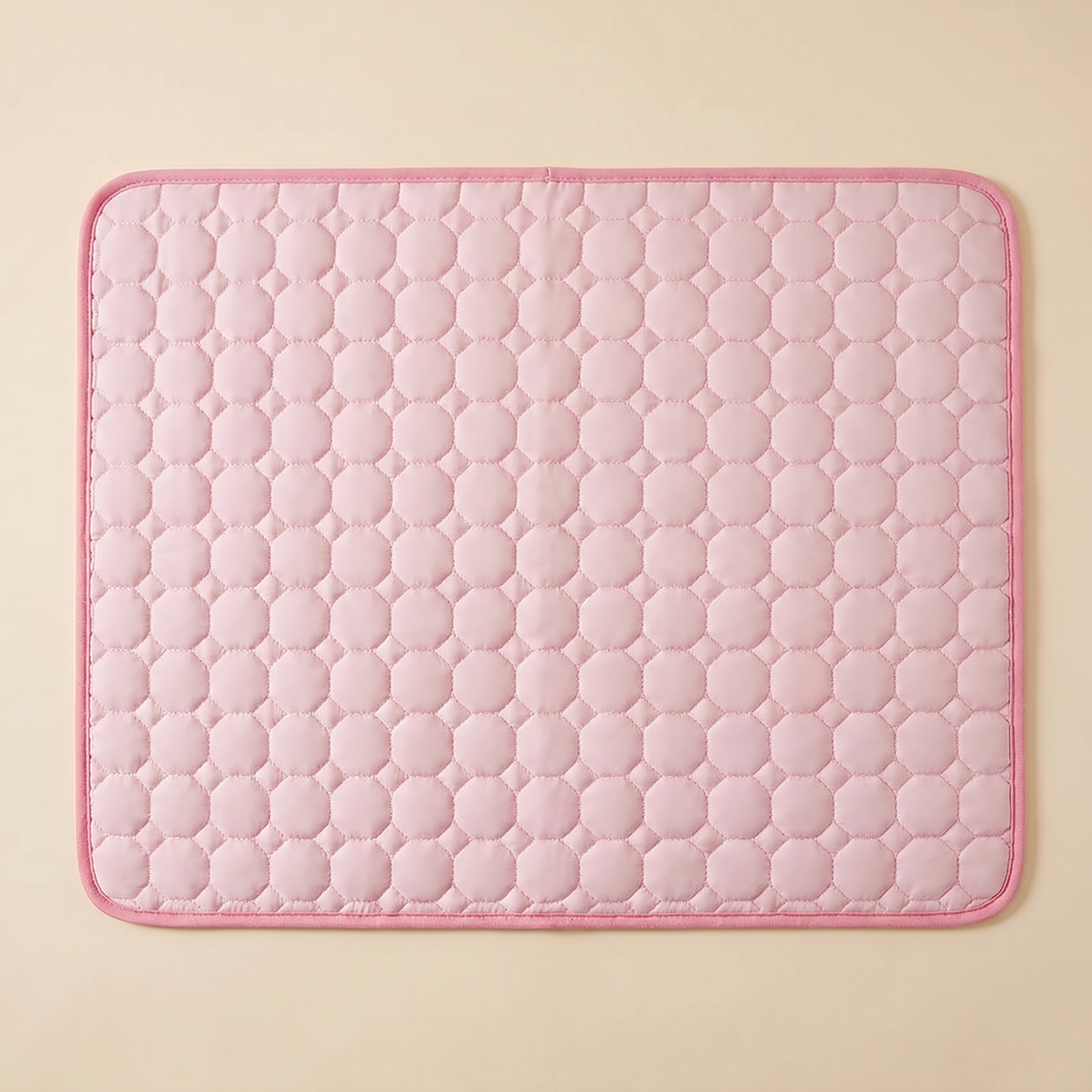 Soft pink quilted pet cooling mat with hexagon pattern for cats and dogs comfort