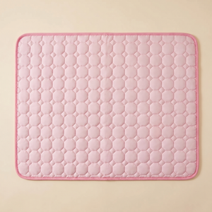 Soft pink quilted pet cooling mat with hexagon pattern for cats and dogs comfort