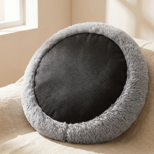 Cozy round pet bed with plush gray rim and black dotted cooling mat, perfect for cats and dogs.